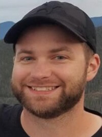 Profile picture of Justin Gerads with Colorado mountains in the background